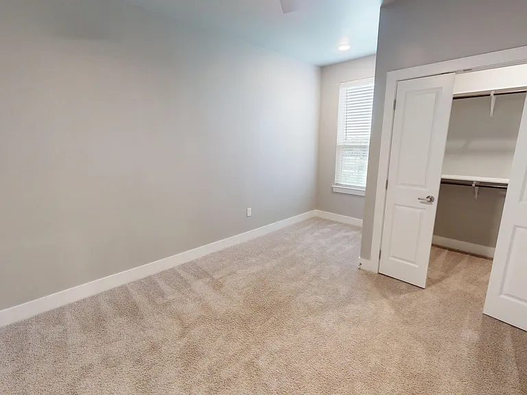 Sling Station's primary bedroom includes a cozy nook and walk-in closet with custom shelving. Sling Station's primary bedroom includes a cozy nook and walk-in closet with custom shelving.