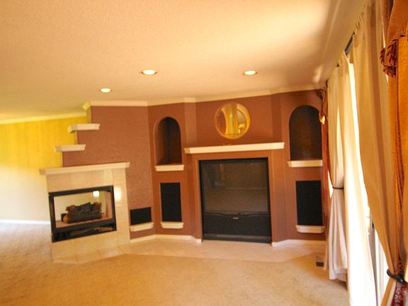 Living Room with TV, Speakers and Fireplace