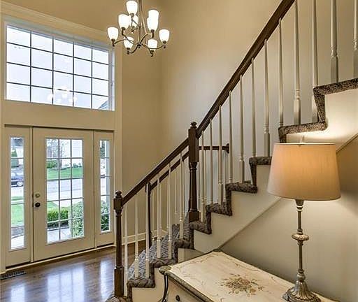 Gleaming wood floors, new stair carpet and updated lighting welcome you to this fantastic home.