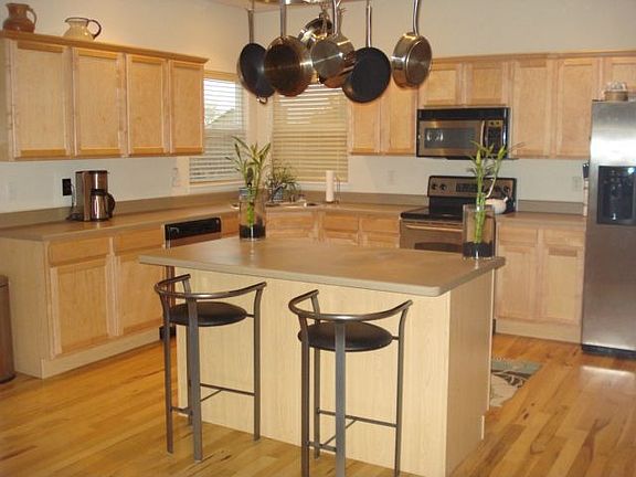 Elegant kitchen with island and stainless steel appliances