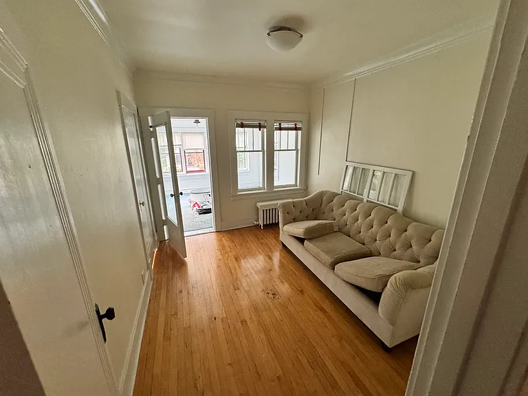 third bedroom to sun room through door