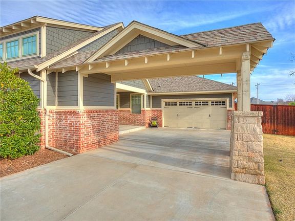 Attached garage, plus a side porch with its own entrance, and additional covered parking!