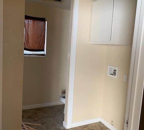laundry area and second bathroom with a shower