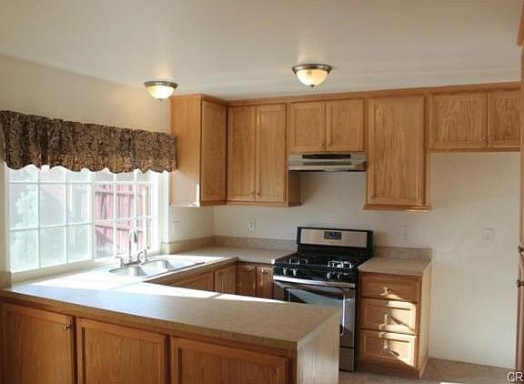 New cabinets, dishwasher, hood; newer range.