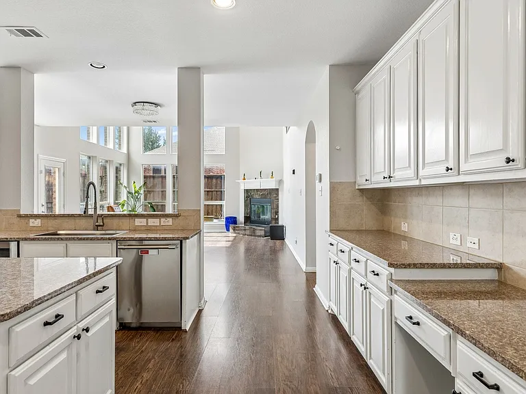 This kitchen has counter top and cabinets for miles.