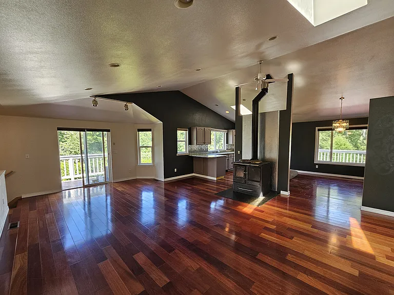 Open floor plan with gorgeous cherry hard wood flooring