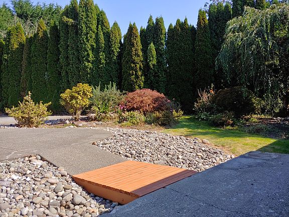 Bridge from house porch to patio and gardens