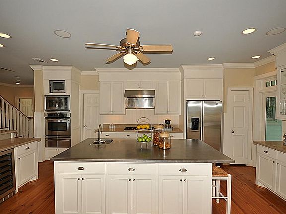 Spacious modern kitchen with a walk in pantry and broom closet. No shortage of cabinets here. Stainl