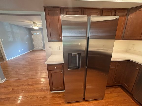 Kitchen w/ Refrigerator with Built-In Ice Maker and Water Dispenser