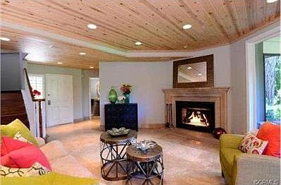Relaxing, and inviting; the living room features a cozy fireplac