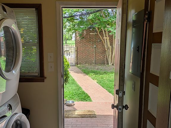 Area laundry with view of backyard.
