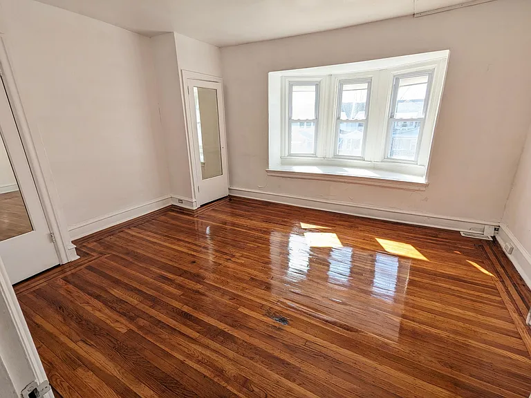 Master bedroom. Big window. 2 closets.