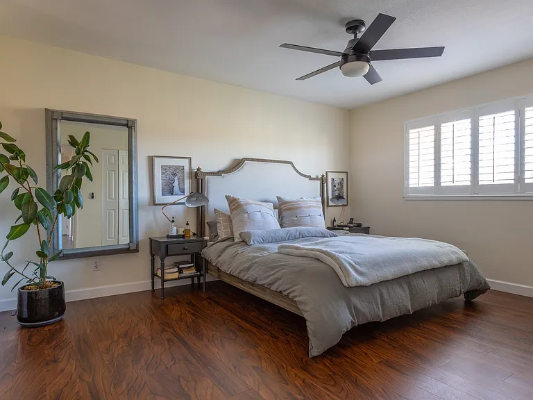 Primary bedroom with two closets and dresser