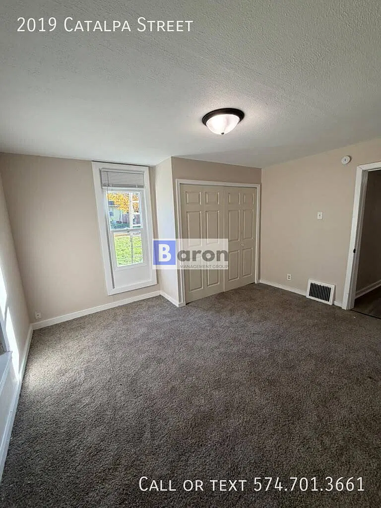 "Charming 4-Bed Home with Gleaming Hardwood Floors at 2019 Catalpa St, South Bend!" — Photo 2