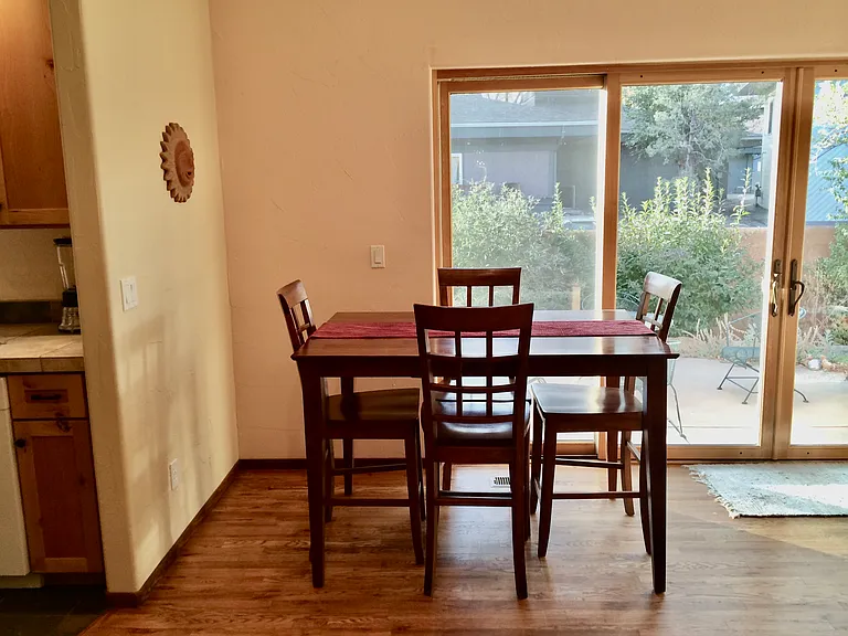 Informal dining area with double wide sliding glass doors and access to the back yard and 2 patios.
