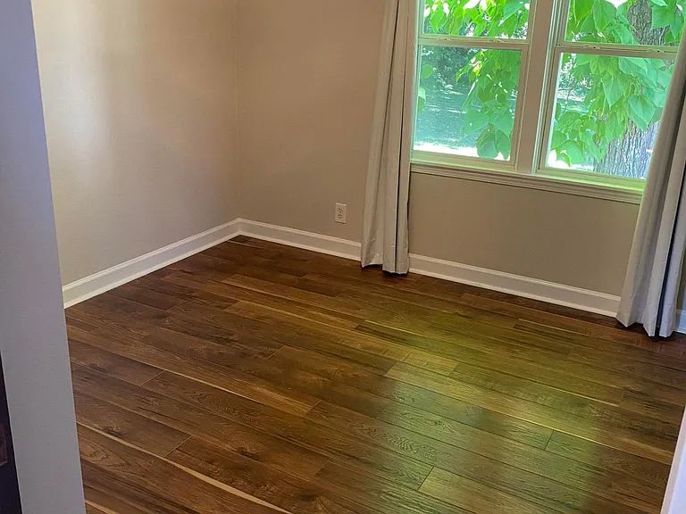 Bedroom in back with closet and in house washer/dryer. Faces backyard for complete privacy