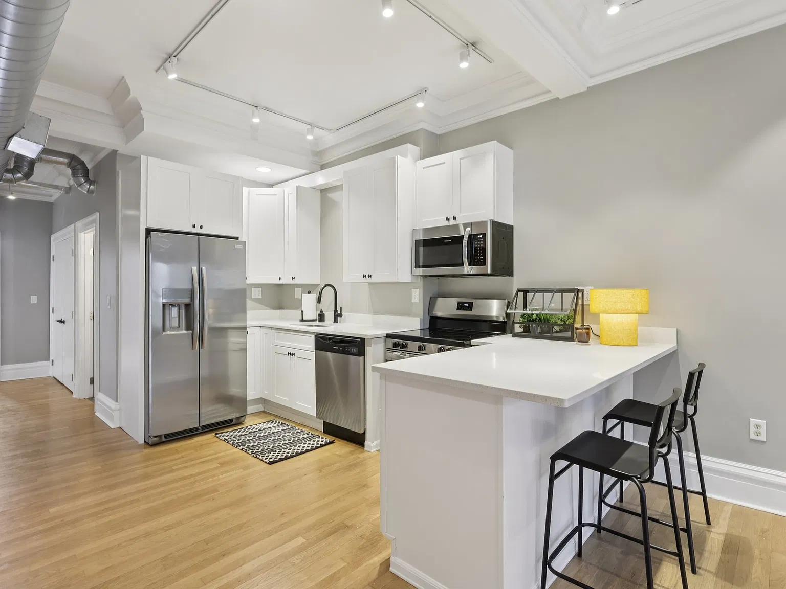 Brand new kitchen with stainless steel appliances.