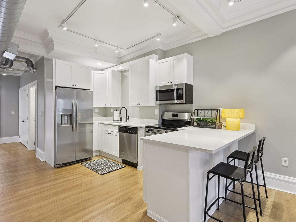 Brand new kitchen with stainless steel appliances.