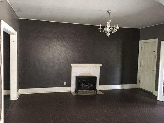 Living room. Hardwood floor and gas fireplace.
