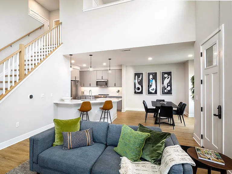 Signature Collection Townhome kitchen, dining room, and living room with hard surface flooring