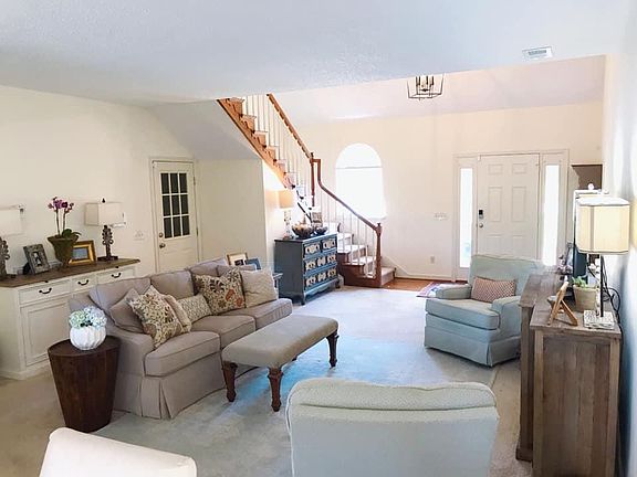 Open living & dining room shines with tons of natural light.