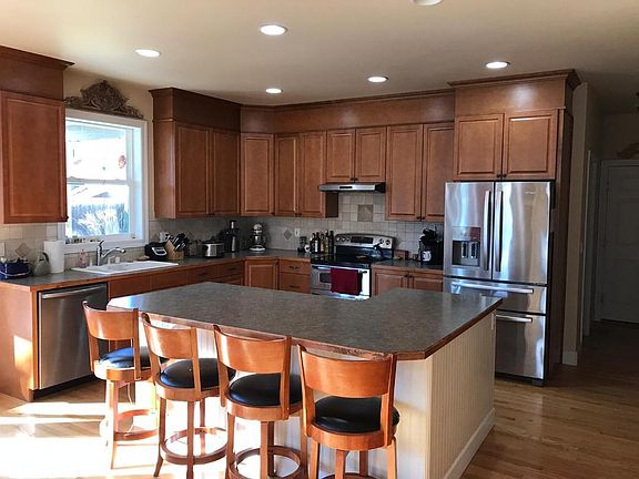 Kitchen with large island, stainless steel appliances