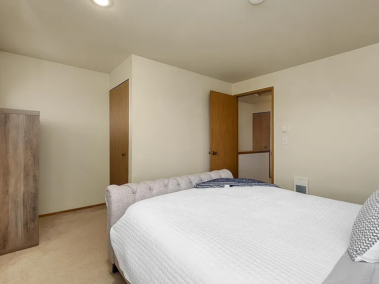 Primary bedroom with double closets.