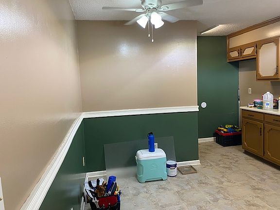 Just inside kitchen. Plenty of counter space. Fridge (we don't supply) goes into the corner at the end of the counter.