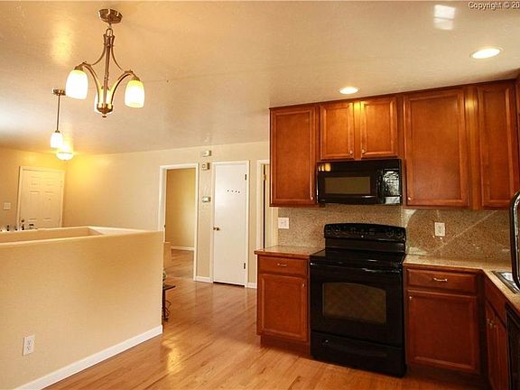 Kitchen and rooms as viewed from the sliding patio door