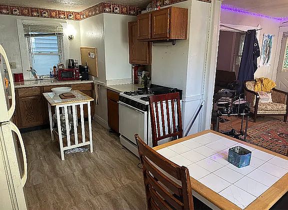 Kitchen with table and chairs, and food prep, Island