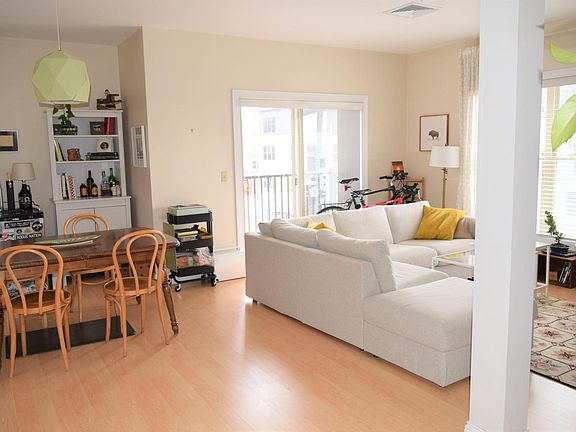 This is a likeness photo. Unit F has 2 bedroom/offices off living room and a long hallway to main bedroom with another slider .