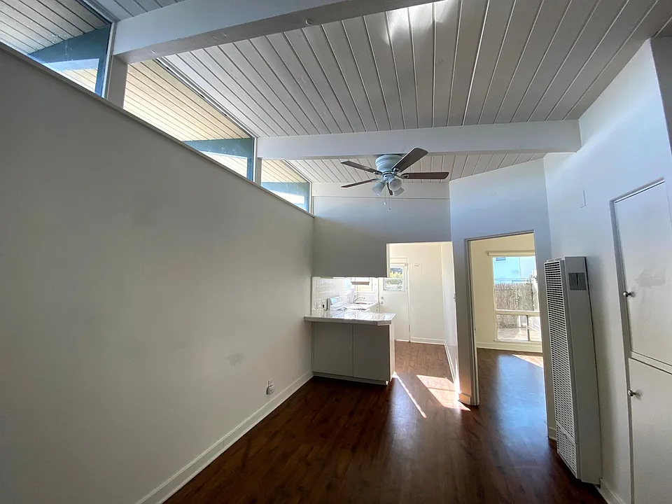 So much natural light! And charming original beams