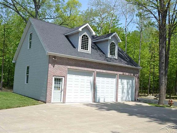 36 x 30 Heated garage with workshop and above storage area.