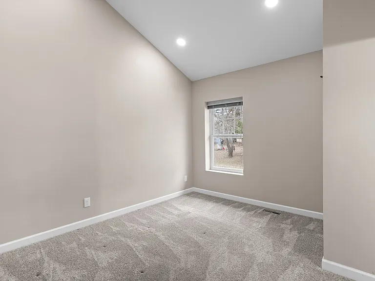 First bedroom. Both bedrooms have en suite bathrooms.