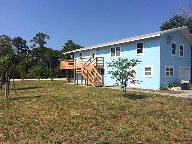 front of home; partial view of woods across the street owned