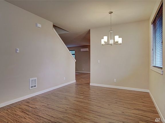 This large open area can be split for a living room and dining room combination or use it for one large living space. Beautiful easy care floors.
