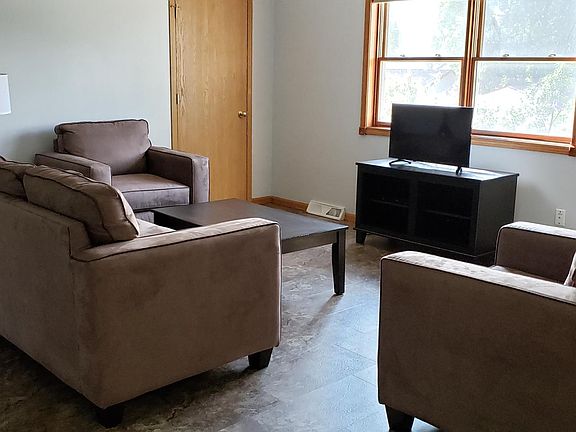 Living room with open floor plan to dinning room