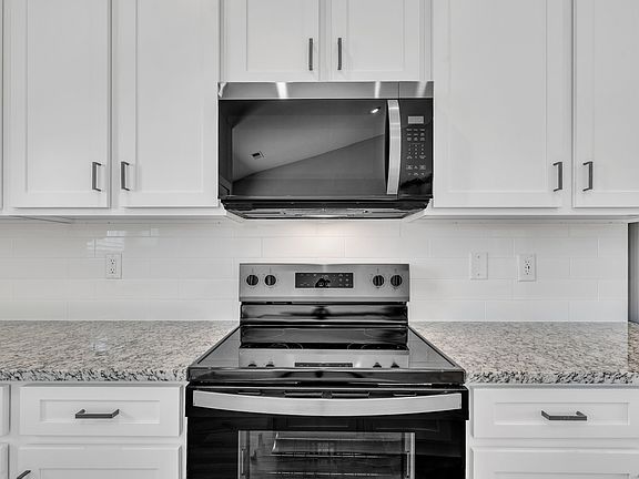 The kitchen comes with brand-new stainless-steel appliances.