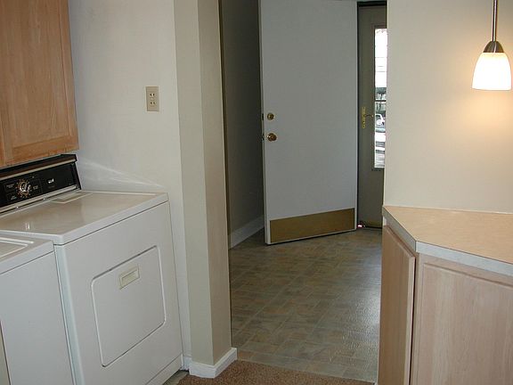 Ground floor laundry off breakfast area, hall storage