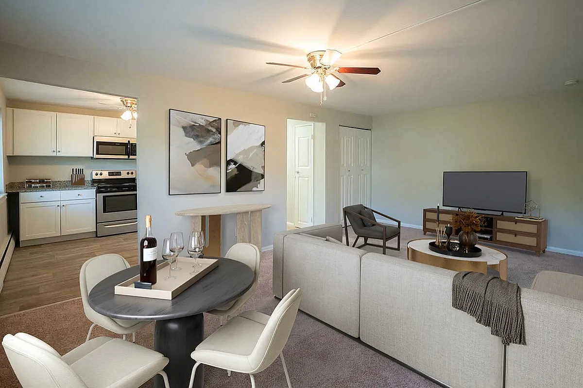 Explore this beautifully designed open-concept living area that seamlessly blends comfort and style. - Stone Gate Woods