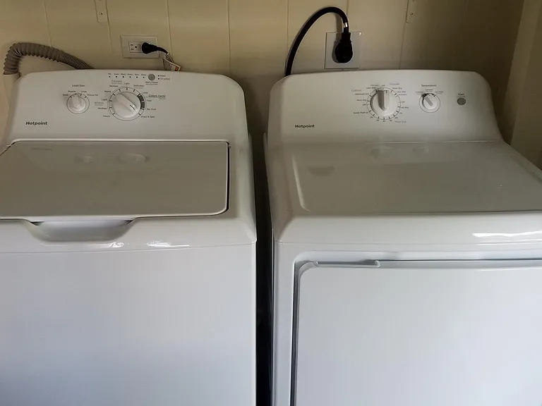 Washer / dryer located in laundry area next to kitchen