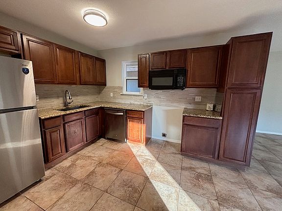New kitchen cabinets, granite, new refrigerator.