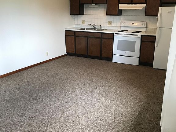 Standing in the front door looking toward the kitchen - living room open to the kitchen