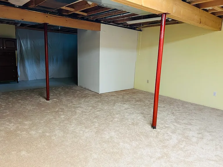 Finished high ceiling clean carpeted Basement
