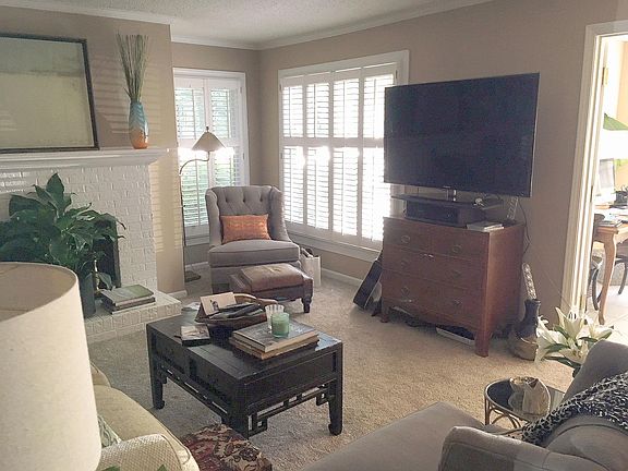 Cozy reading corner with custom shutters.