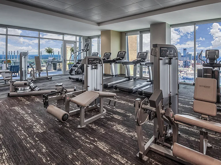 Fully-equipped fitness center with StairMaster and WaterRower