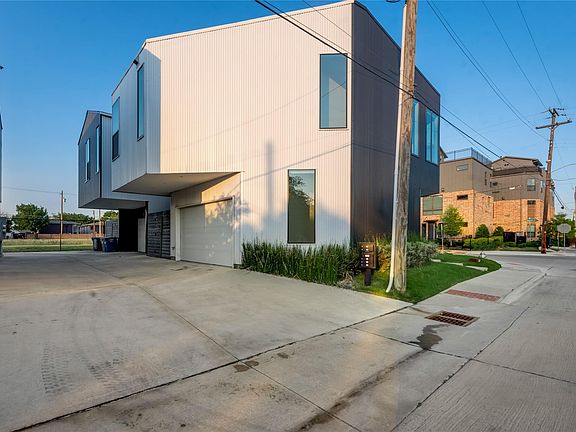 Driveway to garage of units 4 and 5 of Ascend Modern Homes in East Village Dallas.