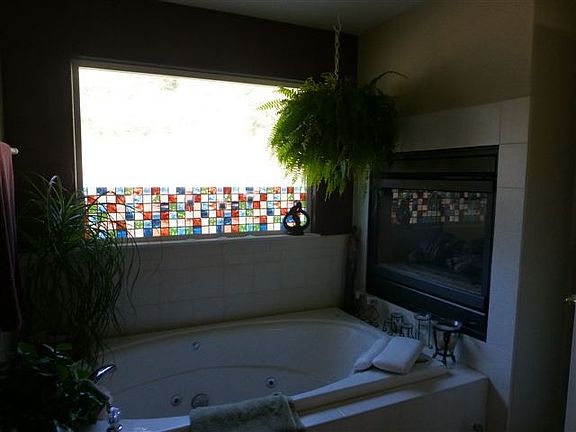 Relax in jaccuzi tub with fireplace