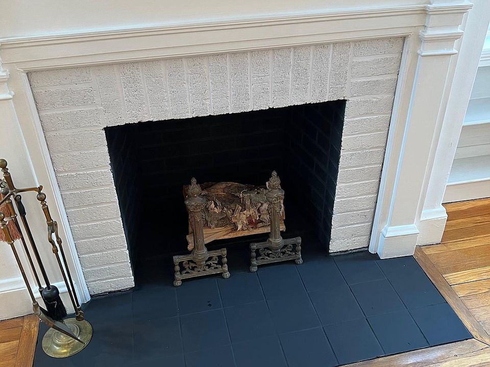 Ornamental fireplace with antique fireplace tools