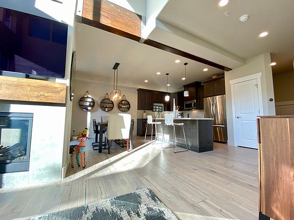 View from living room, looking at dining area and kitchen.
